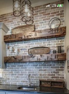 a kitchen with brick walls and wooden shelves