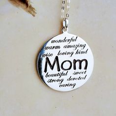 "Mom Silver Pendant Necklace Metal: 925 Sterling Silver Plating:Pure Silver & Anti Tarnish Hallmark:925 Note:Message\"Mom, wonderful, warm, amazing, wise, loving, kind, beautiful, sweet, strong, devoted, caring\" Width:1 5/32 inches Height:1 13/32 inches >Nickel Free >Tarnish Resistant >No Allergic reaction >30 days return policy ++Items come in a gift box ready to be gifted Please contact me if you have any questions about the jewelry you are interested in buying. My Shop: https Sterling Silver Round Charm Necklaces For Mom, Inspirational Necklaces As Mother's Day Gift, Inspirational Personalized Jewelry For Mother's Day, Inspirational Nickel-free Charm Necklace For Mother's Day, Meaningful Sterling Silver Necklaces For Birthdays, Nickel Free Necklaces For Mother's Day, Meaningful Hallmark Jewelry For Mother's Day, Mother's Day Silver Charm Necklace, Mother's Day Hand Stamped Sterling Silver Charm Necklace