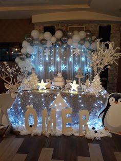 a decorated table with balloons and decorations for an omer birthday party at the hotel