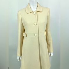 J Crew Cream Wool Lined Winter Button Down Over Coat Gently Used Length 35.5”.Underarms 18.5” Belted Look Warm Functional And Stunning. This Is The One Coat You’ll Want To Keep For Life! Classic Winter White Outerwear With Button Closure, Fitted Beige Pea Coat With Button Closure, Fitted Beige Pea Coat With Buttons, Feminine Fitted Outerwear With Buttons, Fitted Feminine Outerwear With Buttons, Cream Outerwear With Lapel Collar And Buttons, Cream Outerwear With Covered Buttons For Fall, Fall Cream Outerwear With Covered Buttons, Chic Cream Outerwear With Button Cuffs