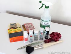 an assortment of crafting supplies on a white table with scissors, glue, and other items