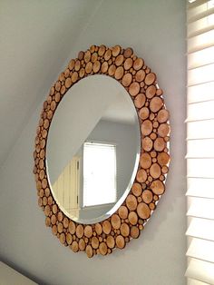 a mirror that is made out of logs