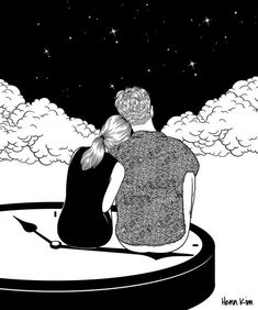 two people sitting in a boat looking at the sky