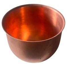 a large metal bowl on a white background