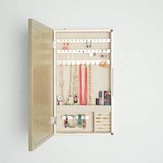 PRICES MAY VARY. Wall hanging jewelry storage mirror Storage options include 25 earring hooks, 10 necklace hooks, 7 divided compartments, a bracelet bar and ring rolls The inside is lined with a anti-tarnish linen Easy opening access design Includes mounting hardware Item Dimensions 3. 2 x 13. 5 x 24 inches Jewelry Storage Mirror, Apartment Closet, Hanging Jewelry Storage, Jewlery Holder, Honey Store, Mirror Jewellery Cabinet, Jewelry Wall, Jewelry Organizer Wall, Hanging Jewelry Organizer