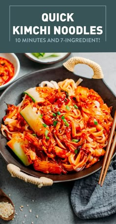 a plate filled with kimchi noodles and chopsticks