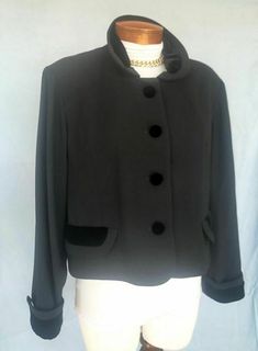 SAKS FIFTH AVENUE Fashion Jacket Sz 14 BLACK 4 Buttons Velvet Trim ELEGANT Classic Description DESIGNER -  Saks Fifth Avenue   SORRY THE PICTURES ARE HARD TO SEE...IT'S SO NICE   STYLE -  This is a lovely 4 button jacket from SFA....it has velvet trim at the collar, cuffs, and buttons and is very pretty on!   COLOR -  Black with black trim   CONDITION -  Great   FABRIC - Polyester   SIZE - 14   MEASUREMENTS: Bust  44" Hipline  42" Overall Length 19"   Please e-me with questions, PayPal preferred Vintage Black Outerwear With Buttons, Black Button-up Outerwear With Covered Buttons, Vintage Black Outerwear With Snap Buttons, Vintage Black Outerwear With Horn Royal Buttons, Black Vintage Outerwear With Button Closure, Vintage Black Outerwear With Covered Buttons, Retro Black Outerwear With Button Closure, Retro Black Blazer For Workwear, Black Retro Blazer For Formal Occasions