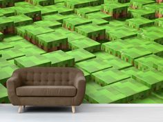 a couch sitting in front of a wall with green squares on it's sides