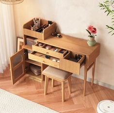 a wooden desk with two drawers and several compartments