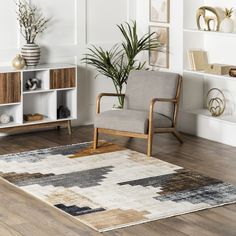 a chair sitting on top of a wooden floor next to a book shelf filled with books