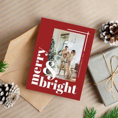 a christmas card with the words merry and bright printed on it next to some presents