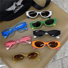 These stylish vintage cat eye sunglasses are designed for both men and women, and are the perfect accessory for any occasion. With UV400 protection and a sturdy polycarbonate frame, these sunglasses are not only fashionable, but also durable and practical. Plus, their unique design and vibrant colors are sure to turn heads and make a statement. From daily wear to parties and travel, these sunglasses are perfect for any adventure. So why settle for ordinary eyewear when you can make a bold and sexy statement with KAMMPT? Experience the difference today! Size: Total mirror width-149mm Frame height-33mm Frame width-49mm Distance between nostrils-17mm Leg length-143mm; Note: 1.There could be some slight differences in the color tone of the pictures and the actual item. 2.Please allow 1-2mm dif Glasses Men Fashion, Glasses Men, Designer Eyewear, Blue Frames, Eyewear Design, Vintage Cat, Mens Glasses, Brand Designer, Fashion Luxury