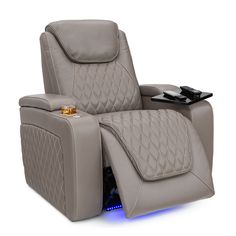 the reclining chair has a remote control on it's arm and foot rest