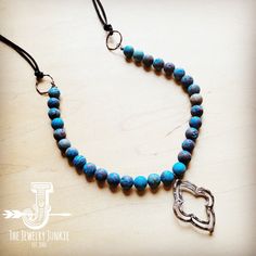 This handmade boho beaded necklace features genuine leather and beads, giving it a unique and bohemian style. The frosted chrysocolla beads add a touch of elegance, while the copper pendant brings a rustic charm. This necklace works well with any outfit and can be dressed up or down. Layer it with l boho shorter necklaces, pair it with some leather earrings, or wear it by itself as a boho statement necklace. This handmade beaded necklace features a combination of multi-colored beads and genuine Bohemian Chrysocolla Beaded Necklaces For Jewelry Making, Adjustable Turquoise Chrysocolla Beaded Necklaces, Adjustable Beaded Turquoise Agate Necklace, Bohemian Adjustable Turquoise Necklace With Wooden Beads, Adjustable Chrysocolla Gemstone Beaded Necklaces, Adjustable Bohemian Turquoise Necklace With Wooden Beads, Bohemian Blue Chrysocolla Beaded Necklace, Blue Bohemian Beaded Chrysocolla Necklace, Blue Bohemian Chrysocolla Beaded Necklace