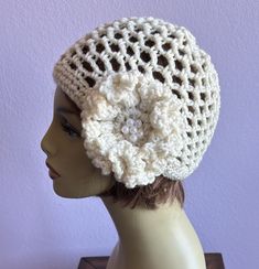 Crochet Summer Beanie Net Cap Women Hat 1920 Style Cloche Retro Hat, Ruffled Flower Hat, Boho Ivory Cream Hat Unique. Inspired by timeless style of the Roaring hat will keep you in 1920s style and looking chic. Roaring timeless style hat that never goes out of fashion. I embellished this big beautiful flower with beads to the hat to give it that special darling look. A great addition for your wardrobe! Fits adult head sizes between 21 inch - 22 inch ( Stretching ) Ivory Cream with beads. Suggest Luxury Summer Cloche Mini Hats, 1920 Style, Cream Hat, Crochet Net, Summer Beanie, Retro Hat, Cloche Hats, Crochet Beret, 1920 Fashion