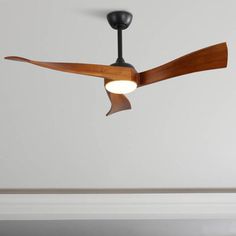 a ceiling fan that is hanging from the ceiling