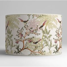 a lamp shade with birds and flowers on it