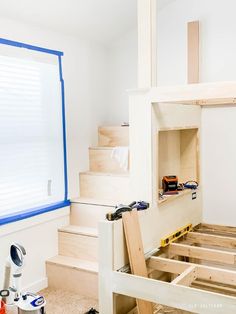 the room is being built and ready to be used as a loft bed for kids