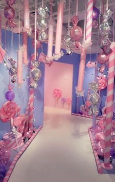 a room filled with lots of pink and purple decorations