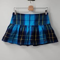 Plaid Skirt With Side Zip Closure Unlined New With Tag Flat Lay Approx. Measurements Waist 15" Length 13" Y2k Style Summer School Bottoms, Y2k Style Blue Skort For Spring, Blue Y2k Style Skort For Spring, Blue Y2k Skort For Spring, School Fitted Tiered Skirt, Casual Tiered Skirt For School, Y2k Fitted Tiered Skirt Bottoms, Y2k Blue Cotton Mini Skirt, Y2k Style Summer Skort For School