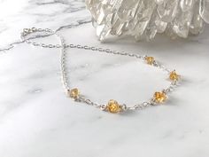 "Raw Citrine crystals are a beautiful rich and warm orange color, representing Confidence, Vitality and Prosperity! Want the set? Buy Citrine Necklace, Earrings and Bracelet for a matching set to accessorize any outfit, looking beautiful with dressy to casual wear. Please check out our other Citrine jewelry designs: https://www.etsy.com/shop/CrystalMinded?ref=seller-platform-mcnav&search_query=citrine - 3-6mm Citrine crystals - Sterling Silver 2.7mm Flat Oval Cable Chain - Sterling Silver fa Amber Beaded Crystal Necklace For Gift, Orange Topaz Birthstone Jewelry, Amber Citrine Birthstone Necklaces, Amber Citrine Birthstone Necklace, Amber Citrine Crystal Necklace As Gift, Amber Citrine Crystal Necklace For Gift, Amber Round Beads Crystal Necklace For Gift, Orange Citrine Gemstone Necklace, Amber Crystal Necklace With Faceted Beads As Gift