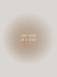 the words one step at a time are written in white on a light gray background