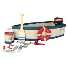 an assortment of toys including a boat, life preserver and other items