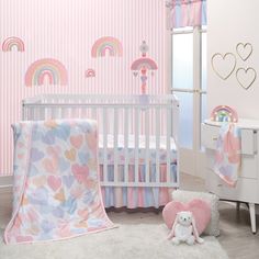 The three-piece crib bedding set includes one quilt, one fitted microfiber crib sheet, and one crib skirt. The quilt front is made in a luxurious minky material with a rainbow of sweethearts. Soft colors of pastel pink, peach, strawberry cream, apricot, lavender mist, and baby blue were used to create this lovely collection. The fitted crib sheet is on a soft white microfiber material with hearts and dots and has elastic all the way around ensuring a safe and secure fit on a standard sized crib Striped Nursery, Baby Crib Bedding Sets, Lavender Mist, Gold Wall Decor, Baby Changing Pad, Rainbow Hearts, Baby Crib Bedding, Fleece Baby Blankets, Bedding Sets Online