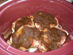 there are four pieces of meat in the crock pot on the stove top, ready to be put into the slow cooker