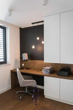 a white chair sitting in front of a wooden desk