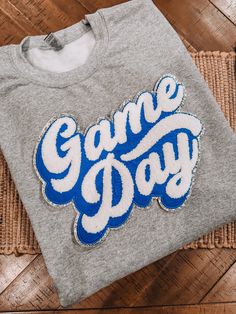 the game day shirt is sitting on top of a mat