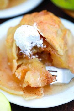 a piece of apple pie on a plate with a fork