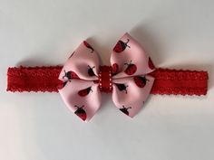 "Pink and Red Ladybug Headband This elastic headband has a circumference of 14\".  The elastic headband has a stretch of 1/2 - 1 \" making it comfortable for your child to wear.  Note: Since every child grows at a different pace details given in the description will be of the circumference of the child's head.  To obtain the measurement of your child's head wrap a flexible, non- stretchable measuring tape around their head at the widest part- just above the eyebrows and ears, and around the back Ladybug Headband, Tape Measure, Elastic Headbands, Hair Accessories Headbands, Baby Headbands, Head Wraps, Eyebrows, Elastic, Hair Accessories