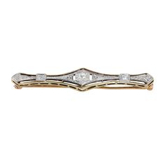 Evoke timeless elegance with our 14K Two-Tone Gold Diamond Antique Vintage Brooch. This exquisite piece features intricate vintage design elements in two-tone gold, adorned with sparkling diamonds totaling 0.10 carats. Perfect for adding a touch of vintage charm and sophistication to any attire. Material: 14K Yellow Gold  Weight: 3.6g Length: 10 mm Wide: 2" Diamonds: Center = 0.06Ctw 2 x 0.02Ctw = 0.04Ctw Color And Clarity: G-H/I1 Total Carat Weigth: 0.10Ctw For more of our jewelry products, ple Classic Diamond White Brooch For Anniversary, Classic Diamond White Brooches For Anniversary, Vintage Diamond White Brooches For Formal Occasions, Classic Diamond White Brooch Jewelry, Classic Brooches With Rose Cut Diamonds, Classic Rose Cut Diamond Brooches, Classic White Gold Brooches With Single Cut Diamonds, Classic Diamond Brooches For Anniversary, Classic Brooches With Rose Cut Diamonds For Anniversary