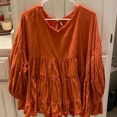 Free People Orange Balloon Sleeve Tiered Tunic Size Small New Without Tags Very Flattering Fit! Fall Cotton Top With Lantern Sleeves, Cotton Top With Lantern Sleeves For Fall, Oversized Orange Long Sleeve Blouse, Oversized Long Sleeve Orange Blouse, Flowy Lantern Sleeve Tops For Fall, Spring Cotton Lantern Sleeve Tops, Fall Cotton Blouse With Lantern Sleeves, Lantern Sleeve Cotton Tops For Spring, Cotton Lantern Sleeve Top For Spring