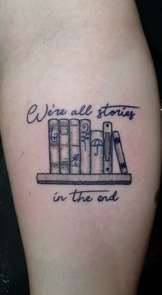 a tattoo with some books on it and the words wine all stops in the end