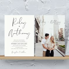 the wedding announcement card is displayed on a shelf