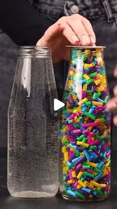 two jars filled with different colored sprinkles