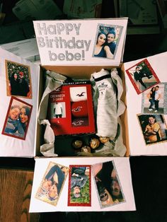 an open box with photos and pictures on it