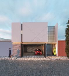 a red car is parked in front of a modern house with an open garage door