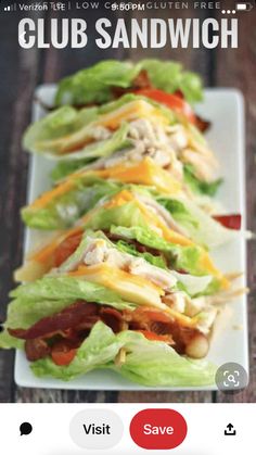 several lettuce wraps are lined up on a white plate with cheese and bacon