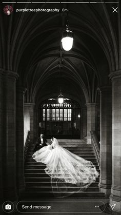 a woman in a wedding dress is walking down the stairs with her long veil blowing in the wind