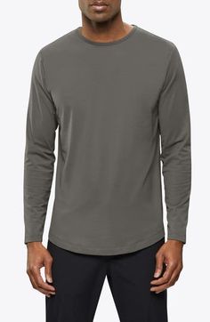 Made from a soft cotton blend, a versatile long-sleeve T-shirt enhanced with a curved hem is an instant closet favorite that looks great alone or layered. 28 1/2" length (size Medium) Crewneck Long sleeves 62% polyester, 33% cotton, 5% spandex Machine wash, tumble dry Imported Versatile Long Sleeve T-shirt, Casual Long Sleeve Crew Neck Top With Thumbholes, Casual Long Sleeve Top With Thumbholes, Crew Neck Long Sleeve Cotton Top With Thumbholes, Cotton Long Sleeve Crew Neck Top With Thumbholes, Cotton Long Sleeve Top With Thumbholes And Crew Neck, Basic Long Sleeve T-shirt For Layering, Casual Gray Tops With Thumbholes, Fall T-shirt With Shirttail Hem