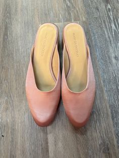 Brand: Mari Giudicelli Style: SHOES DESIGNER Color: LIGHT PINK Size: 8 Other Info: MARI GIUDICELLI - SIZE 38. Model Number: LEBLON MULES SKU: 137-13745-279480 CONDITION: GENTLY USED Pink Synthetic Flats For Spring, Spring Mules With Rubber Sole And Medium Width, Pink Round Toe Flats For Spring, Pink Mules With Padded Heel And Round Toe, Pink Round Toe Mules With Padded Heel, Pink Almond Toe Flats With Medium Width, Pink Almond Toe Flats Medium Width, Pink Flats With Rubber Sole For Spring, Pink Slip-on Flats With Round Toe