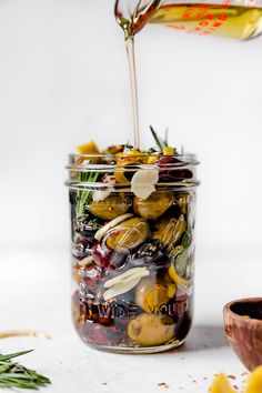 a jar filled with olives and other vegetables