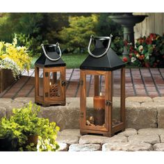 two wooden lanterns sitting on top of stone steps