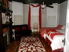 a bed room with two beds and a rug