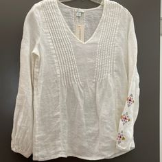 Beautiful Linen Top With Embroidery On The Sleeves In Gold, Silver Blush And Black. New With Tags From Sundance. White Embroidered Blouse With Relaxed Fit, White Embroidered Relaxed Fit Top, White Casual Top With Embroidered Neckline, White Embroidered V-neck Top, White Fitted Embroidered Top With Embroidered Hem, Fitted White Embroidered Top With Embroidered Hem, Casual White Top With Embroidered Neckline, Fitted White Blouse With Geometric Embroidery, Fitted White Top With Geometric Embroidery