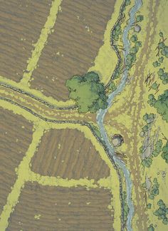 an aerial view of a river running through a field