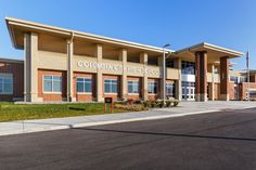 an empty street in front of a building with the words columbia city high school written on it